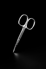 metal manicure scissors isolated on black