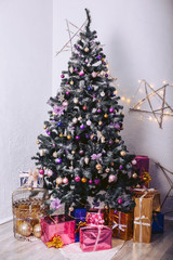 Christmas tree with gift boxes and decorative elements