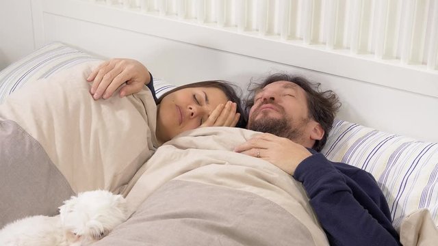 Couple in bed feeling sick with flu and fever slow motion