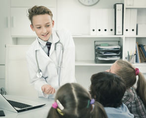 Medic boy with stethoscope talking