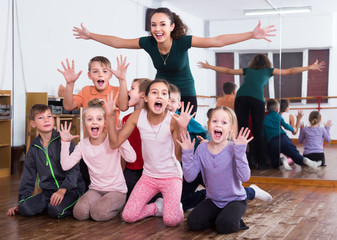 Positive children  in dance studio having fun