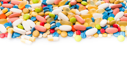 pills border over white. colorful pills isolated on white