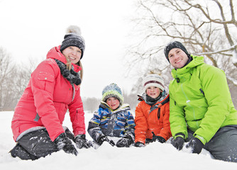 Fototapeta na wymiar family and child spending time outdoor in winter