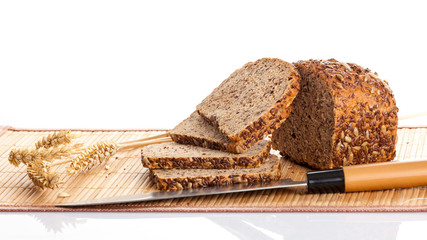 Sliced  bread on cutting board. knife and bread