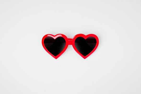 Sunglass in the shape of a heart on a white background