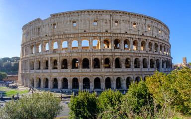 Fototapeta na wymiar Colosseum Rome. Ruins of the ancient Roman amphitheatre. Travel to Italy, Europe. Crowd and queue. Sunny day and blue sky