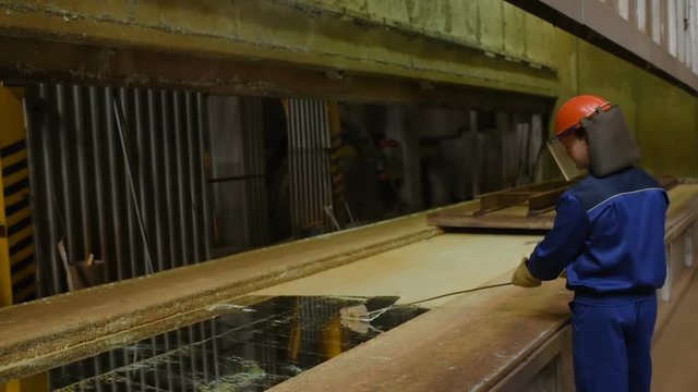 hot dip galvanizing. Industrial worker against the background of a bath with liquid zinc