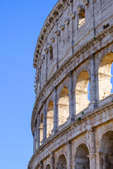 Fototapeta premium Colosseum Rome. Ruins of the ancient Roman amphitheatre. Travel to Italy, Europe. Crowd and queue. Sunny day and blue sky