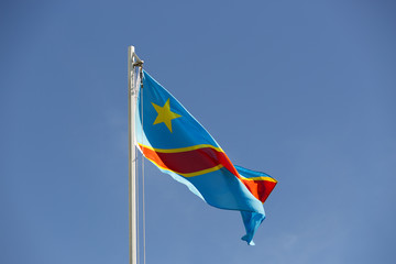 National flag of Congo on a flagpole