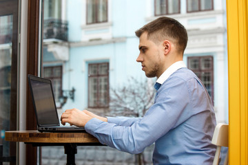 man hand use laptop connecting wifi internet businessman busy at office desk finger typing computer sitting wooden table cafe with vintage
