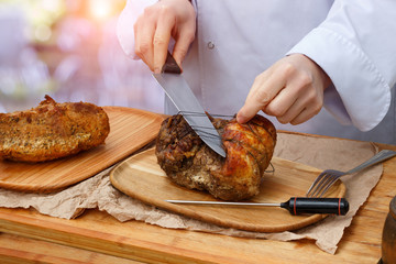 Chef prepares the meat for cutting.