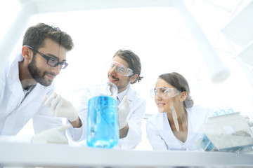 Group of scientists working on an experiment at the laboratory