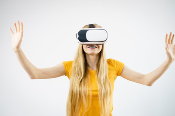 Girl wearing virtual reality goggles.