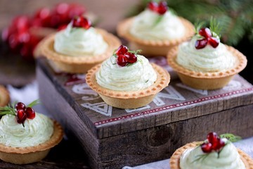 Tartlets with avocado pasta, cottage cheese, fish caviar and pomegranate.