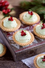 Tartlets with avocado pasta, cottage cheese, fish caviar and pomegranate.