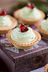 Tartlets with avocado pasta, cottage cheese, fish caviar and pomegranate.