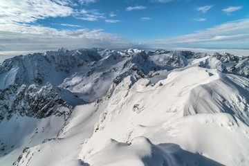 Obraz premium Sunny day in winter snowy Tatra mountains in Slovakia 