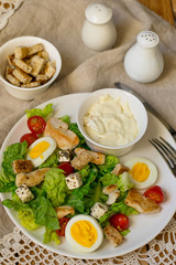Caesar salad with lettuce, grilled chicken and vegetables