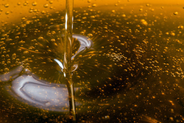 Pouring olive oil liquid