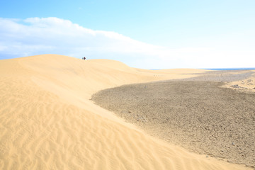 Fototapeta na wymiar Sand dunes on the Atlantic coast in Maspalomas on Gran Canaria Island, Canary Islands, Spain