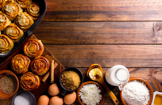 Table full of ingredients for the preparation of cinnamon rolls with cheese. golfeados desserts typical in Venezuela.