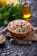 Mix of brown, red and wild rice in bowl