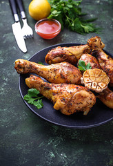 Grilled chicken legs with spices and garlic.