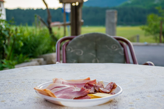 The owner of the house in the village Negushi offered tourists to taste the prosciutto.