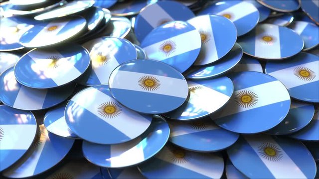 Pile of badges featuring flags of Argentina