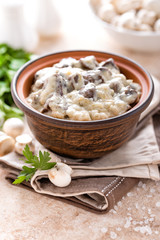 Mushrooms in creamy sauce, julienne. Champignon