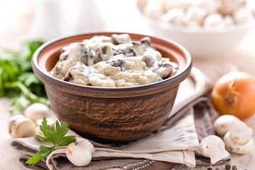Mushrooms in creamy sauce, julienne. Champignon