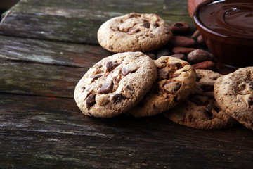 Chocolate cookies on wooden table. Chocolate chip cookies shot.