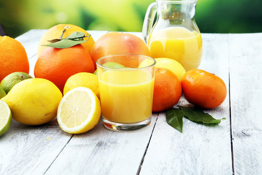 Citrus background. Assorted fresh citrus fruit. Lemon, orange lime, grapefruit. Fresh and colorful concept.