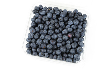 Fresh blueberry in the plastic box isolated on white background