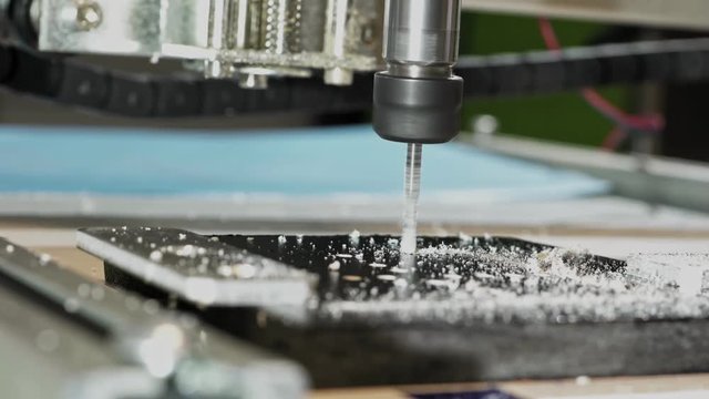 CNC milling machine proceccing plastic detail.Cutting plastic  modern processing technology.