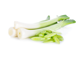 whole and sliced fresh leek on white background