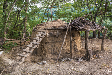 Traditional charcoal pile covered with clay, used for production of charcoal in Serbia