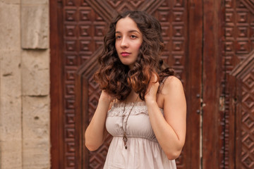 Fototapeta premium Romantic girl with wavy hair