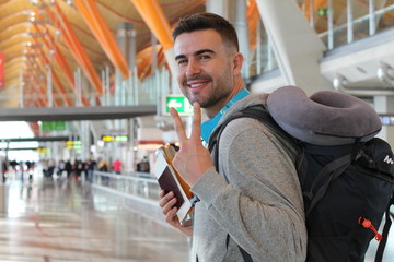 Satisfied traveler giving a peace sign from the airport