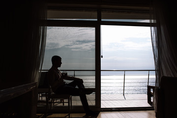 silhouette of a man against the sea, business