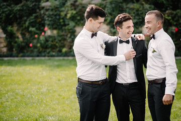 Happy groom and groomsmen