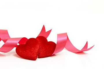 Two red hearts with pink ribbon