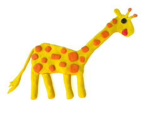 Cute yellow giraffe made from plasticine clay on white background, lovely long neck animal dough