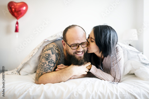 Wife Kissing Husband On Bed Stock Photo And Royalty Free Images Wife Kissing Husband On Bed