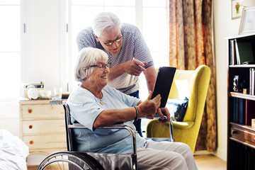 Senior couple using a tablet