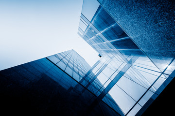 Modern office building against blue sky.