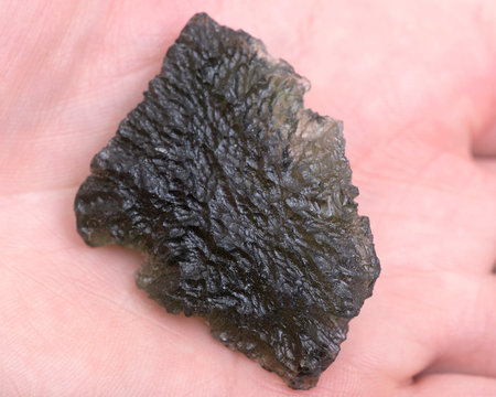 Moldavite - form of tektite found along the banks of the river Moldau in Czech republic
