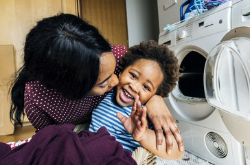 Mother and son doing housework together
