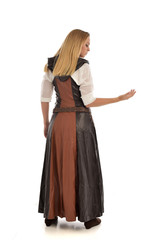 full length portrait of girl wearing brown  fantasy costume, standing pose with back to the camera on white studio background. 