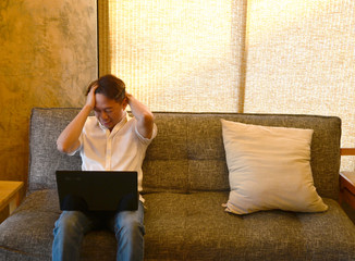 Man headache because he work hard  